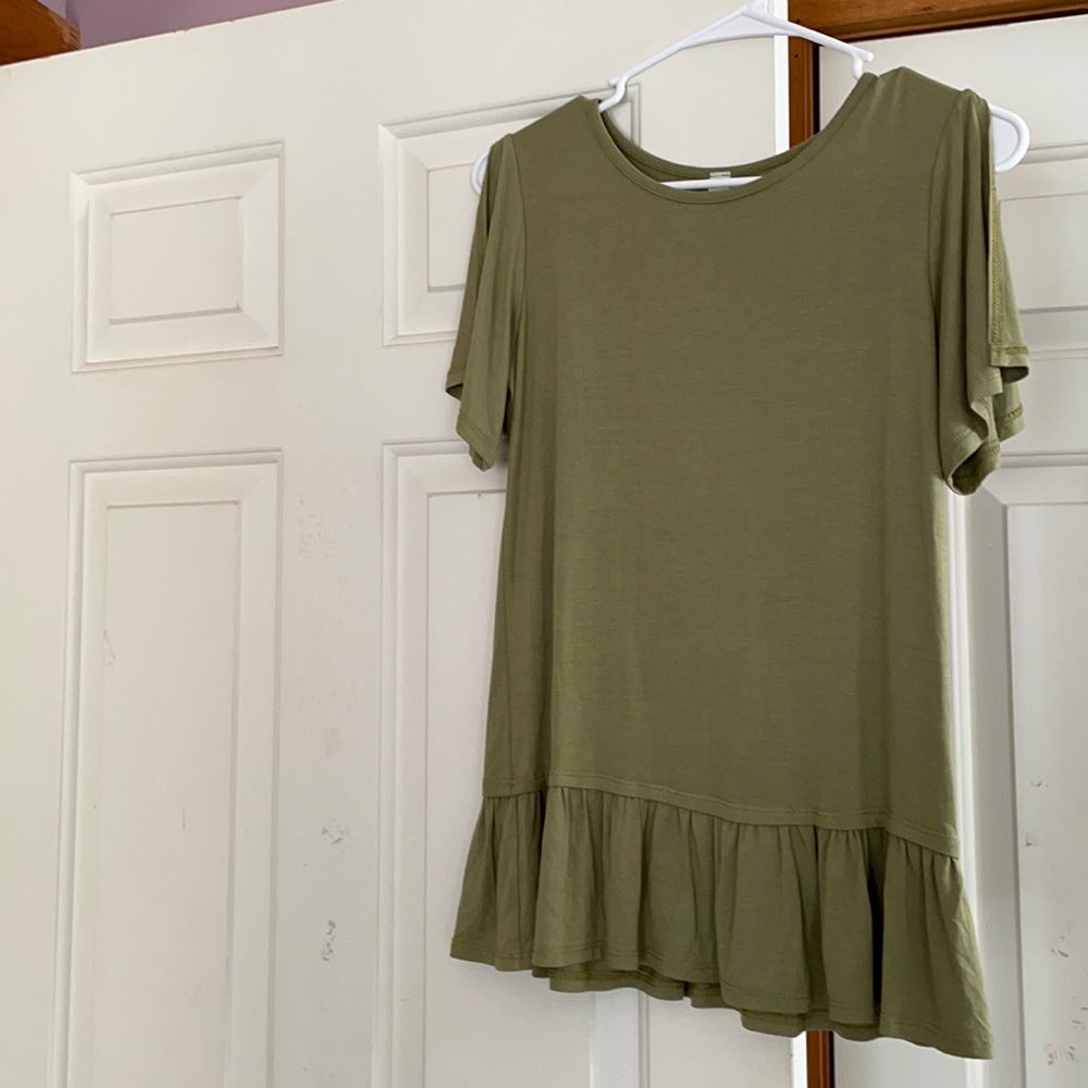 Green shirt from the paper store